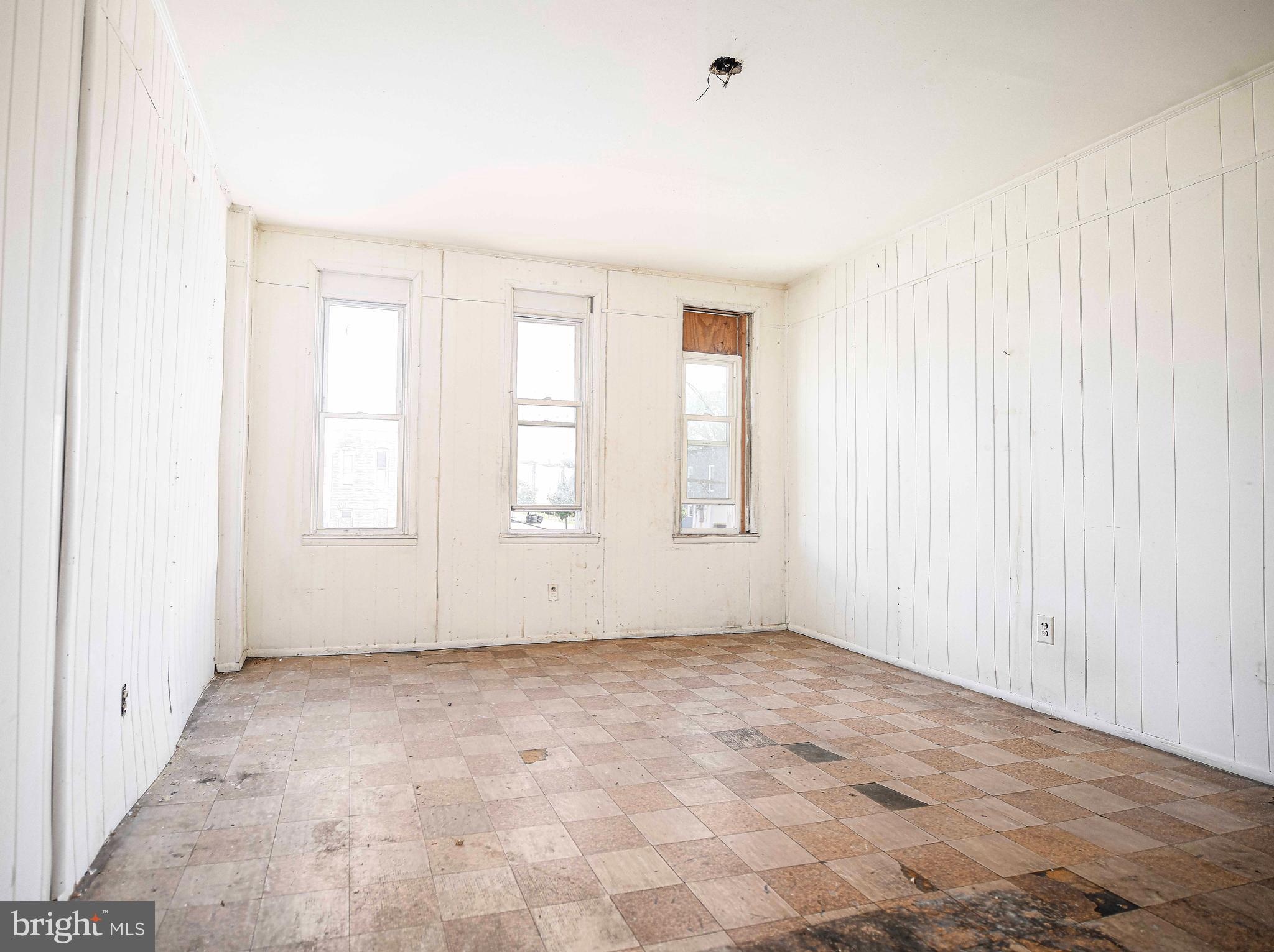 2331 Federal Street Baltimore, MD 21213 - Photo 6 of 15 an empty room with windows