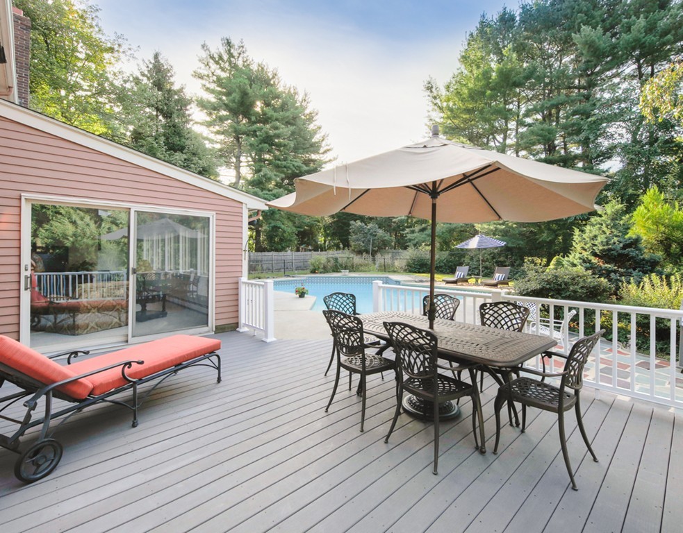 6 Goffe Road Lexington, MA 02421 - Photo 2 of 30 a sitting area with furniture and umbrella