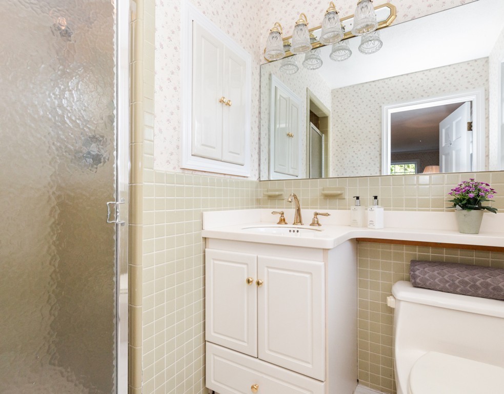 6 Goffe Road Lexington, MA 02421 - Photo 21 of 30 a bathroom with a sink vanity and a mirror
