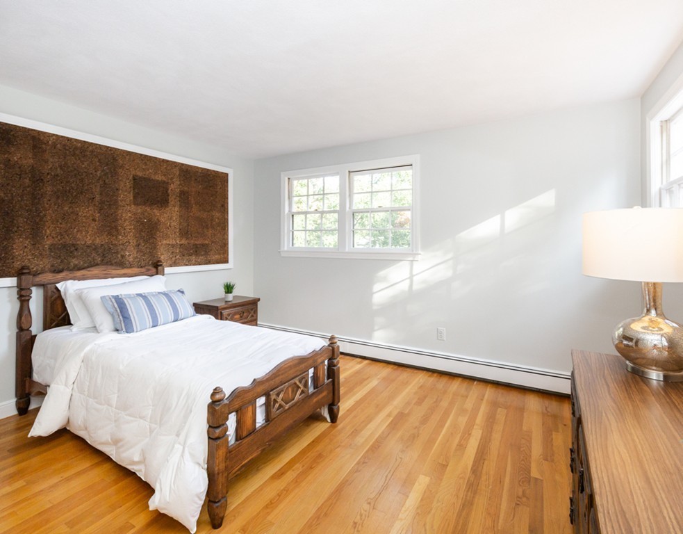 6 Goffe Road Lexington, MA 02421 - Photo 22 of 30 a bedroom with a bed and a night stand