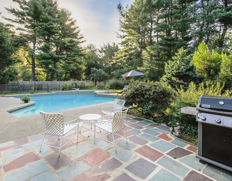 6 Goffe Road Lexington, MA 02421 - Photo 28 of 30 a view of a swimming pool with a patio
