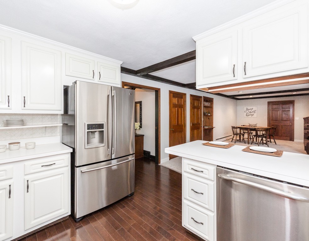 6 Goffe Road Lexington, MA 02421 - Photo 10 of 30 a kitchen with white cabinets and white appliances