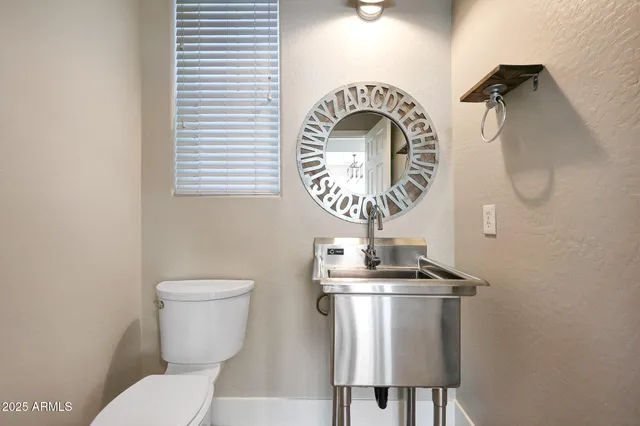 a close view of a sink and a mirror in a bathroom