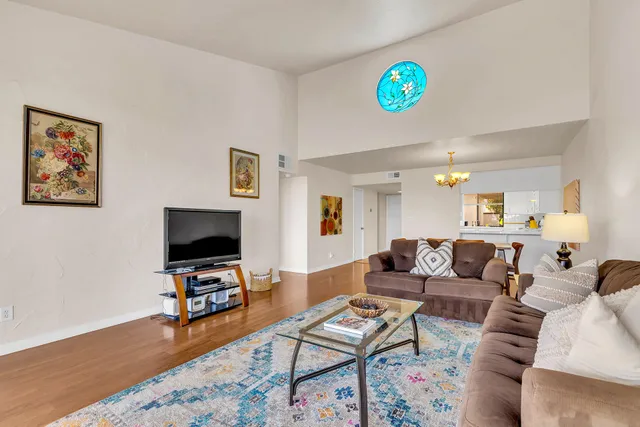 a kitchen with white cabinets and appliances