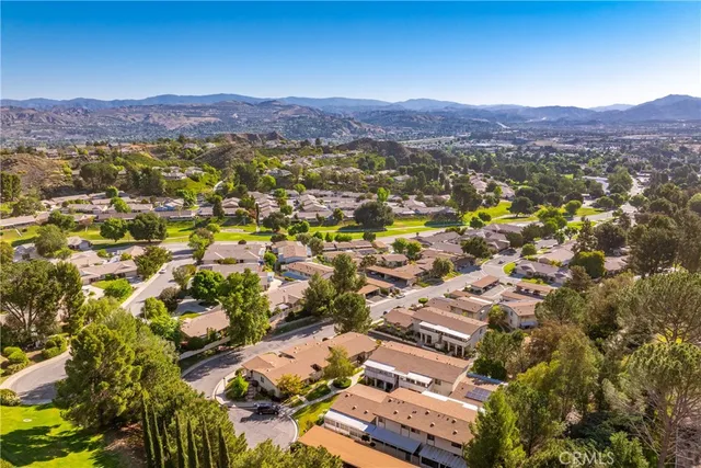 a view of a city with mountains in the background