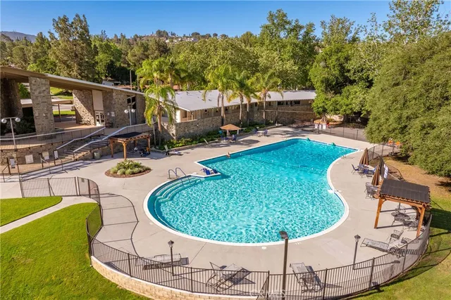 a view of a swimming pool with a patio