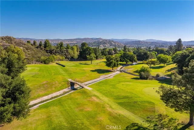 a view of a swimming pool with a yard
