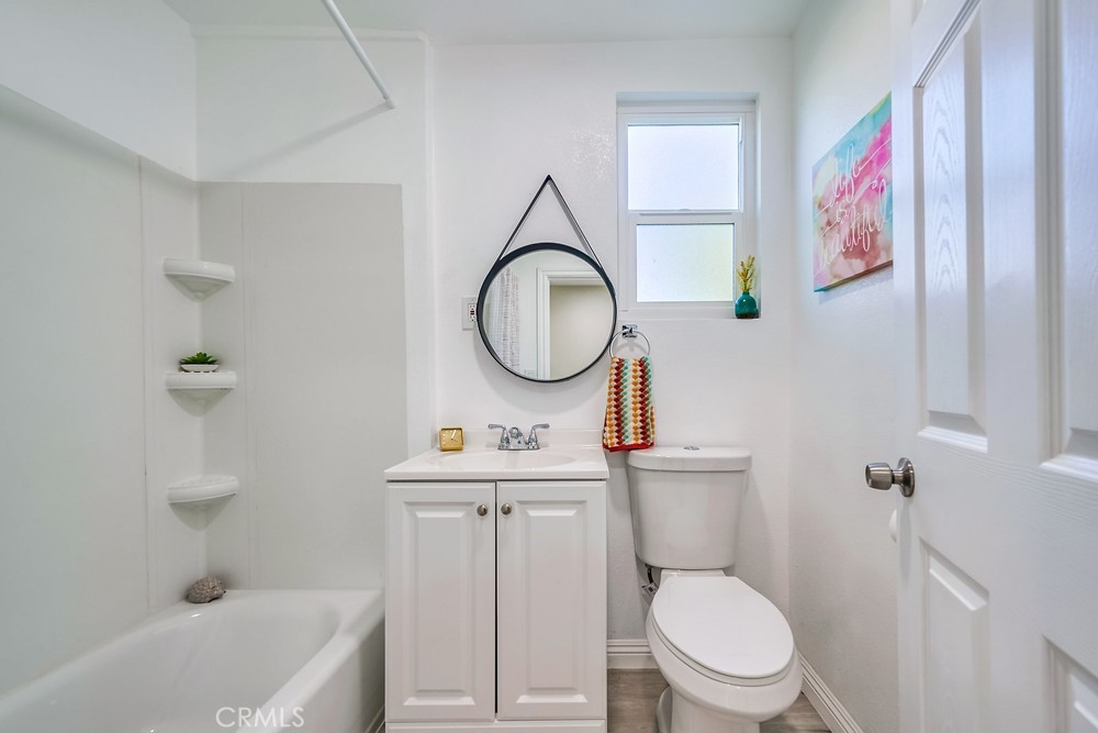 5510 Bushnell Avenue Riverside, CA 92505 - Photo 12 of 23 a bathroom with a toilet a sink and a bathtub