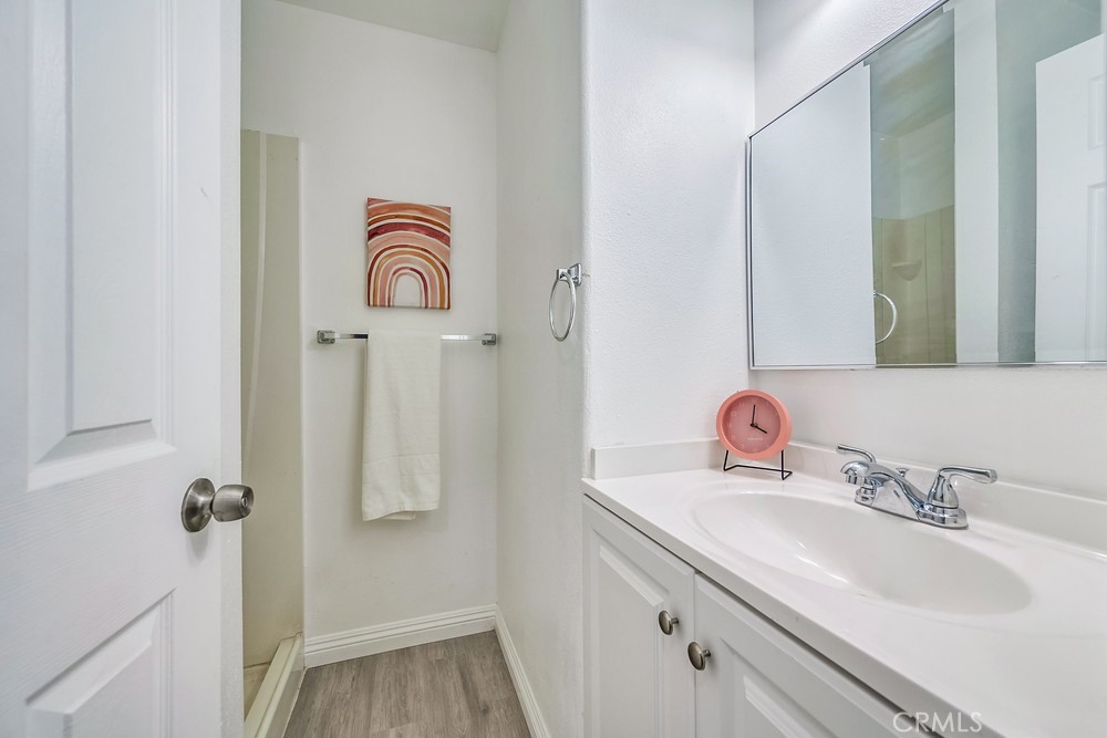 5510 Bushnell Avenue Riverside, CA 92505 - Photo 20 of 23 a bathroom with a sink a mirror and a shower