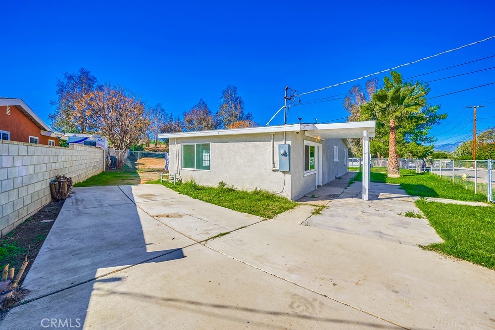 5510 Bushnell Avenue Riverside, CA 92505 - Photo 3 of 23 a view of a white house with a yard