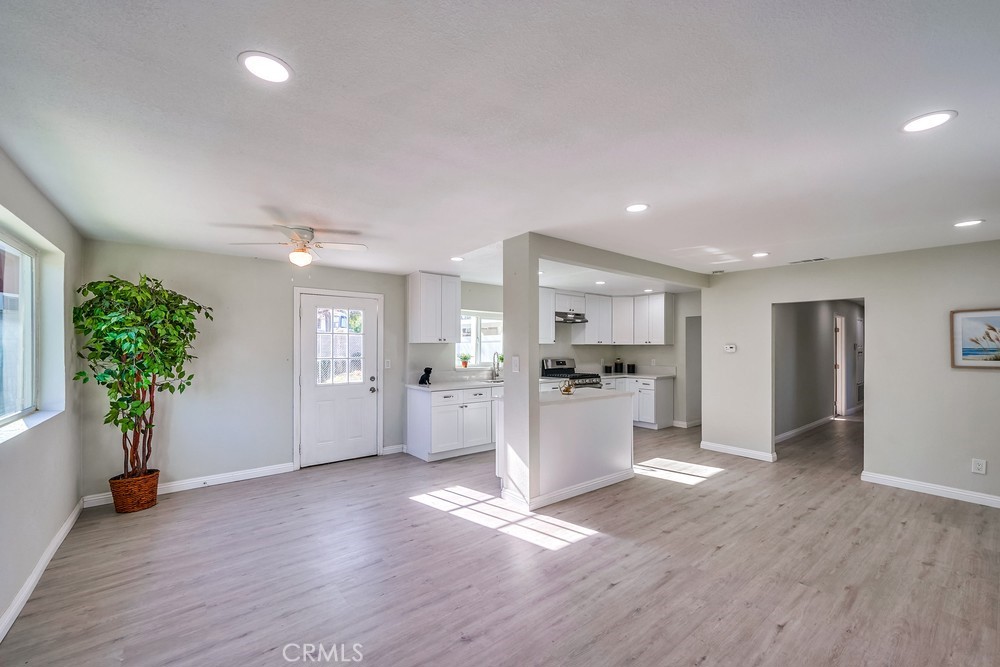 5510 Bushnell Avenue Riverside, CA 92505 - Photo 6 of 23 a view of a big room with wooden floor and windows