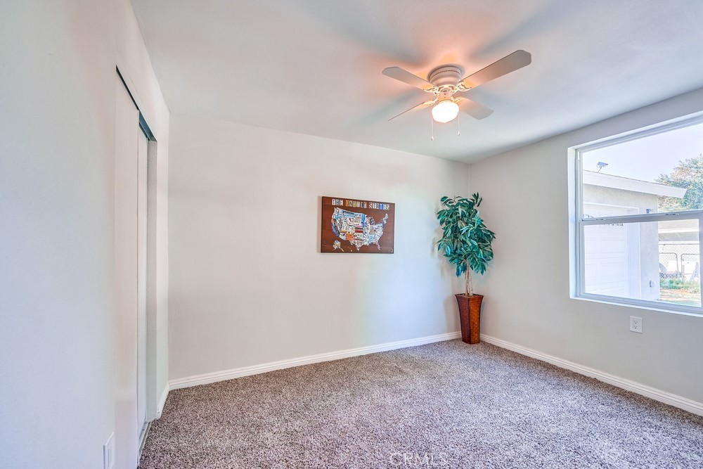 5510 Bushnell Avenue Riverside, CA 92505 - Photo 8 of 23 an empty room with windows and fan