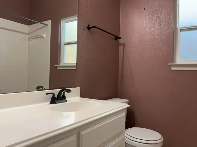 a bathroom with a sink a toilet and a bathtub