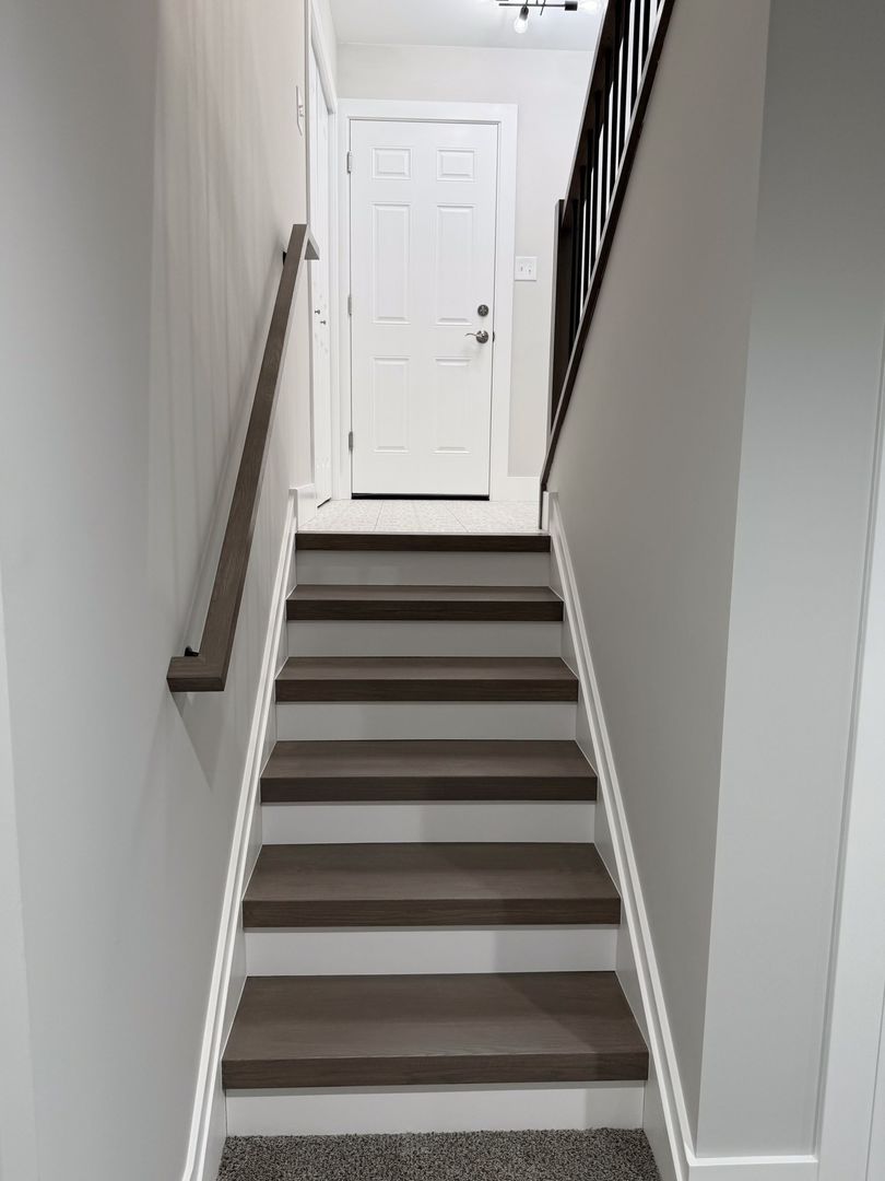 18830 Ruth Drive Mokena, IL 60448 - Photo 19 of 35 a view of staircase with white walls and a window