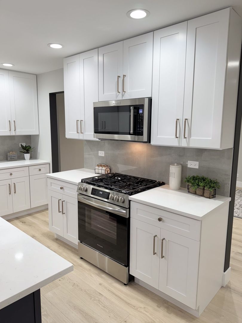 18830 Ruth Drive Mokena, IL 60448 - Photo 8 of 35 a kitchen with white cabinets and stainless steel appliances