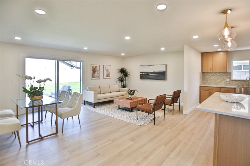 6401 Royal Oak Drive Huntington Beach, CA 92647 - Photo 13 of 49 a living room with furniture and a wooden floor