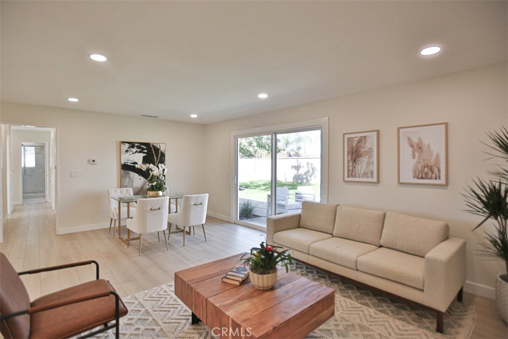 6401 Royal Oak Drive Huntington Beach, CA 92647 - Photo 18 of 49 a living room with furniture a rug and a window