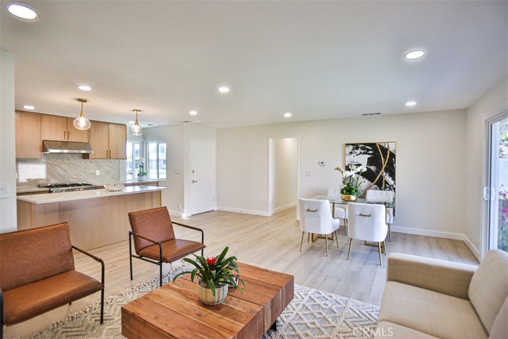 6401 Royal Oak Drive Huntington Beach, CA 92647 - Photo 25 of 49 a living room with furniture and a view of kitchen