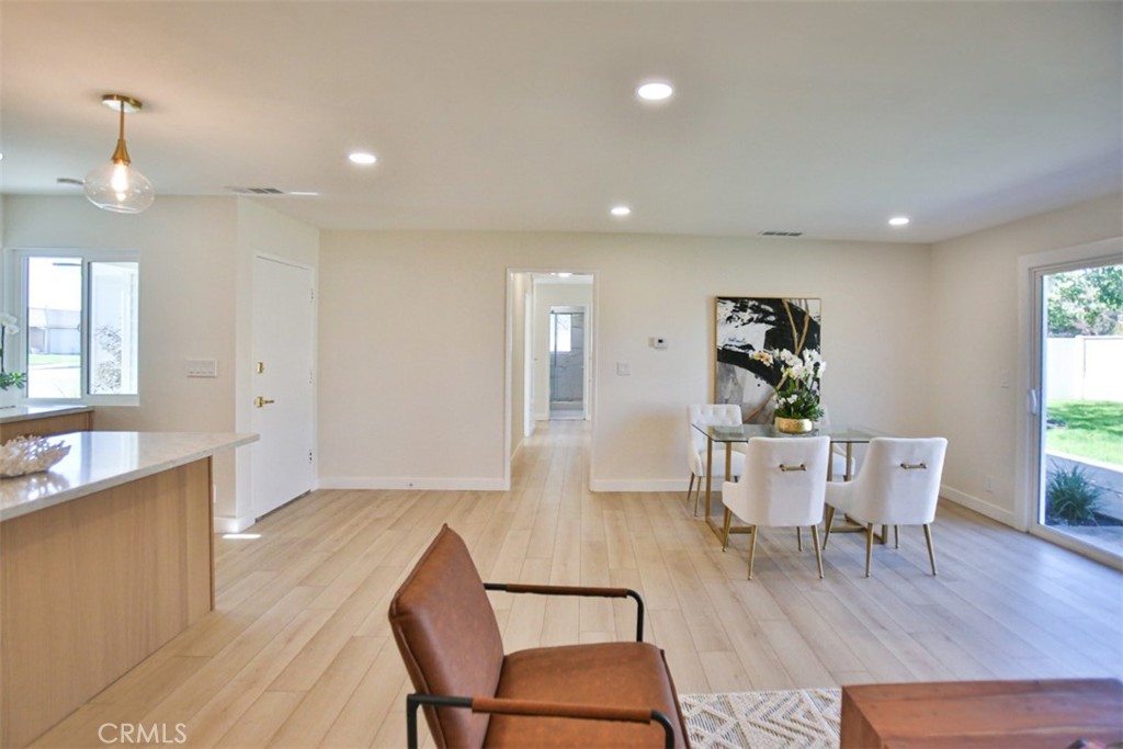 6401 Royal Oak Drive Huntington Beach, CA 92647 - Photo 27 of 49 a view of a dining room with furniture and wooden floor