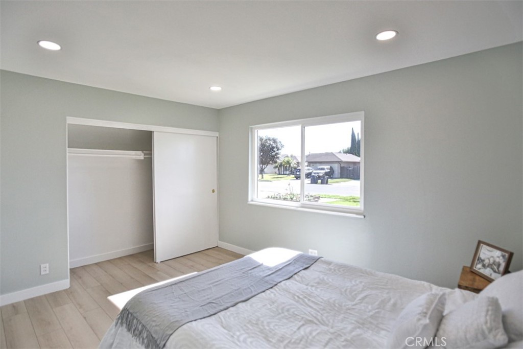6401 Royal Oak Drive Huntington Beach, CA 92647 - Photo 46 of 49 a bedroom with a bed and a window