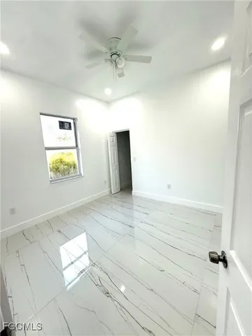 a bathroom with a double vanity sink toilet mirror and shower
