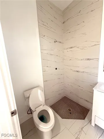 a view of an empty room and a window