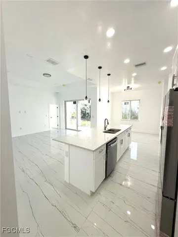 a bathroom with a double vanity sink and mirror