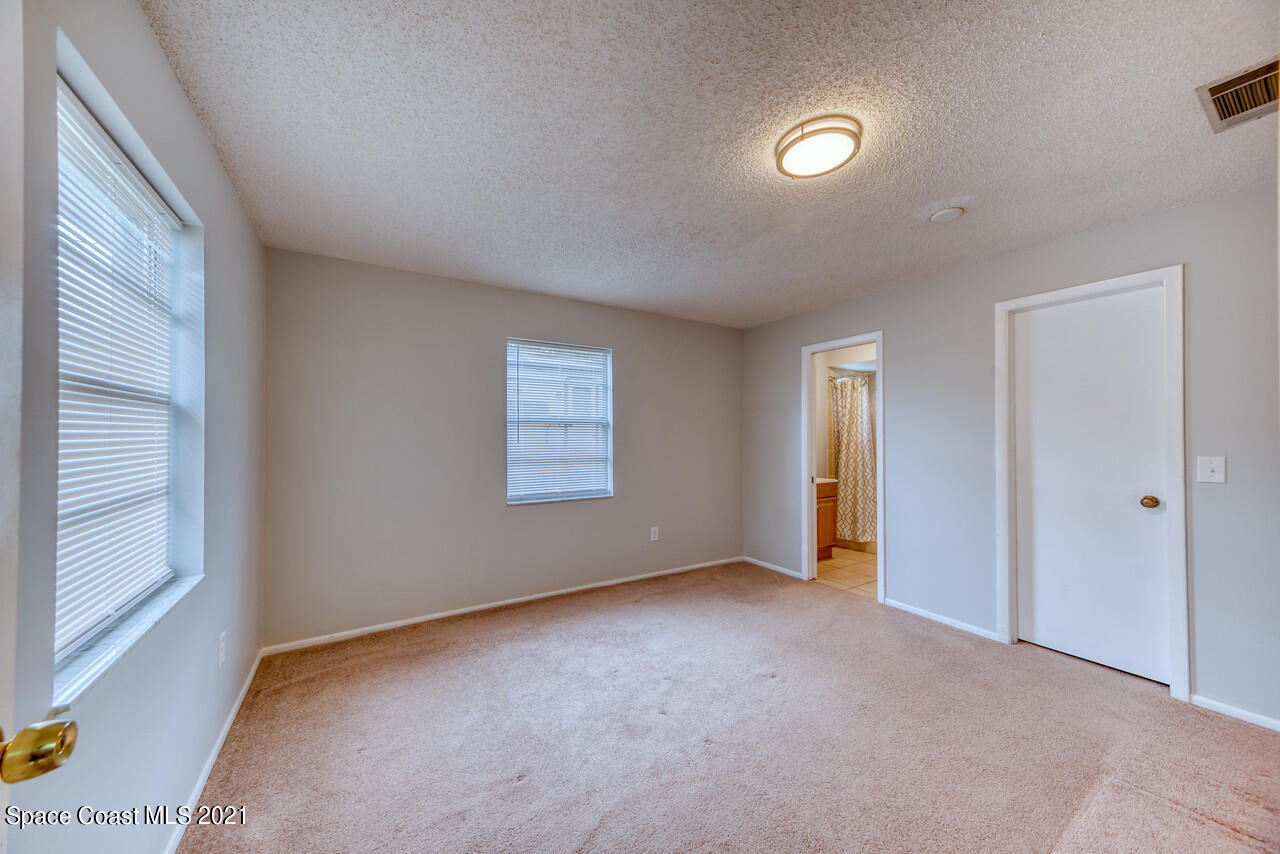 553 Edward Road West Melbourne, FL 32904 - Photo 13 of 26 a view of an empty room with a window