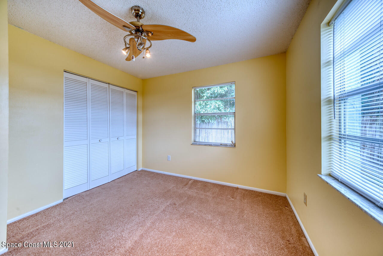 553 Edward Road West Melbourne, FL 32904 - Photo 19 of 26 a view of an empty room with a window