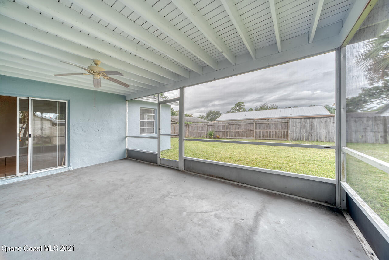 553 Edward Road West Melbourne, FL 32904 - Photo 22 of 26 a view of an empty room with glass door