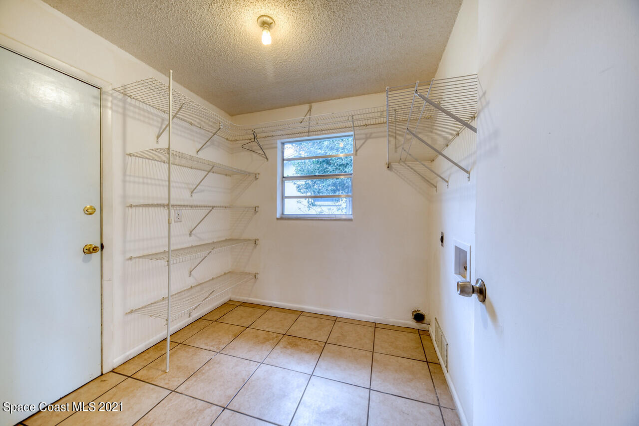 553 Edward Road West Melbourne, FL 32904 - Photo 23 of 26 a view of a room with storage and utility