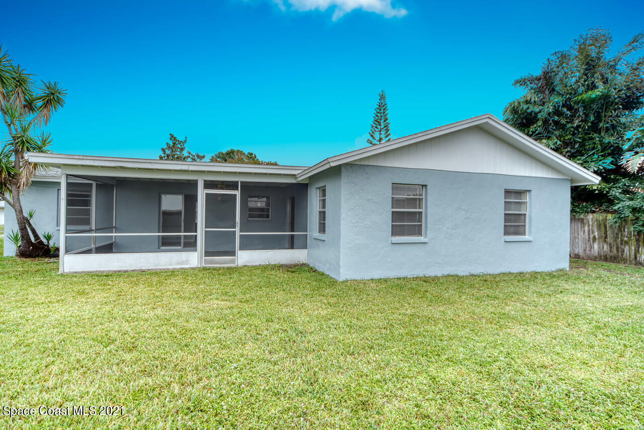 553 Edward Road West Melbourne, FL 32904 - Photo 24 of 26 a view of a house with a yard