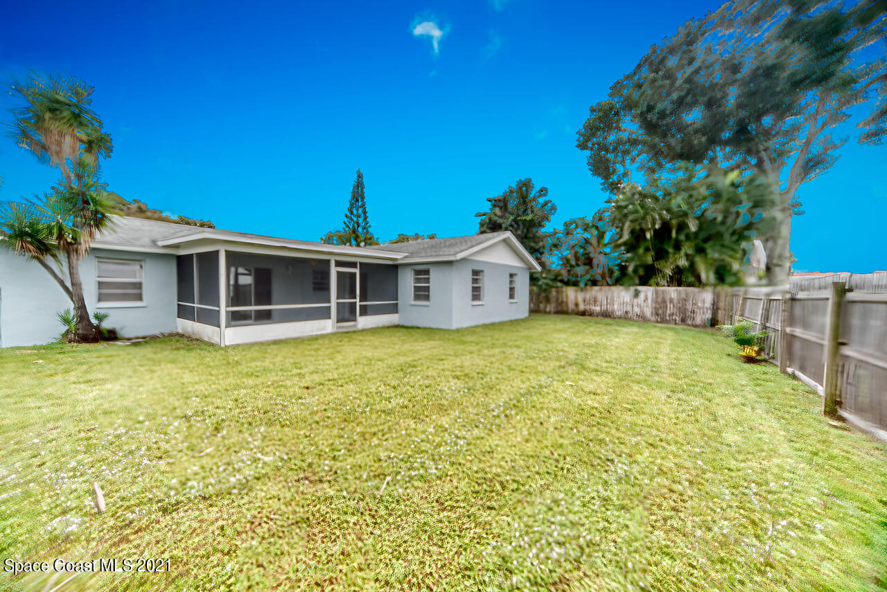 553 Edward Road West Melbourne, FL 32904 - Photo 26 of 26 a front view of a house with a garden