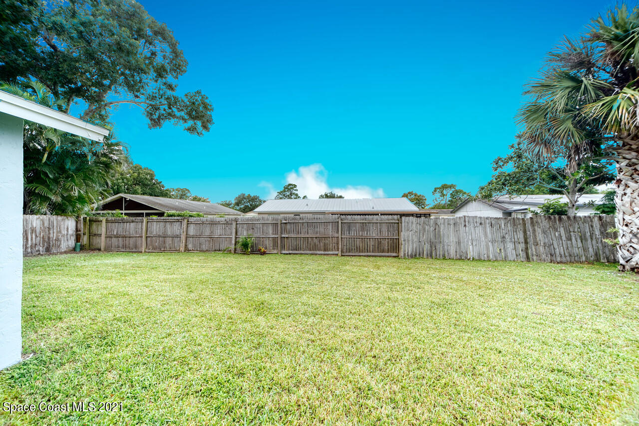 553 Edward Road West Melbourne, FL 32904 - Photo 8 of 26 a house view with a garden space