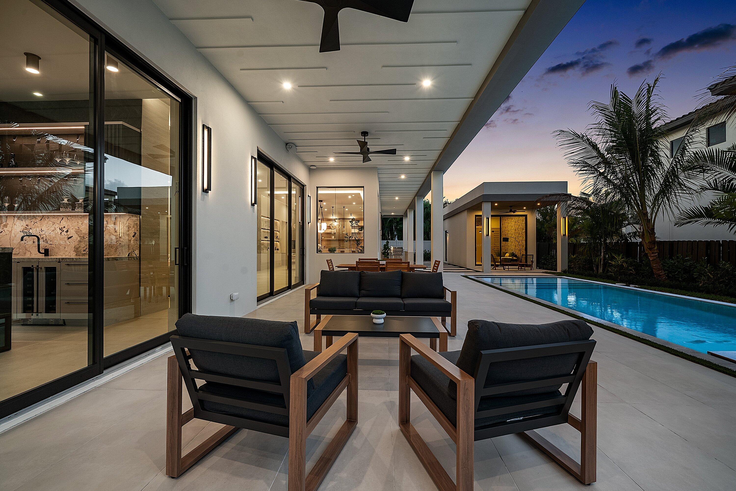 299 Northeast 7th Street Boca Raton, FL 33432 - Photo 102 of 112 a outdoor space with lots of furniture and a garden