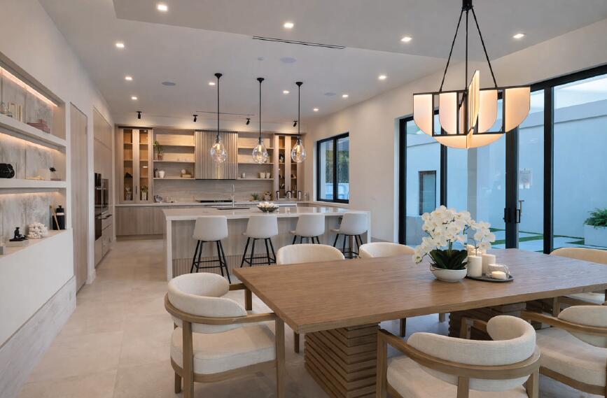 299 Northeast 7th Street Boca Raton, FL 33432 - Photo 109 of 112 a kitchen with stainless steel appliances granite countertop a kitchen island a table and chairs in it