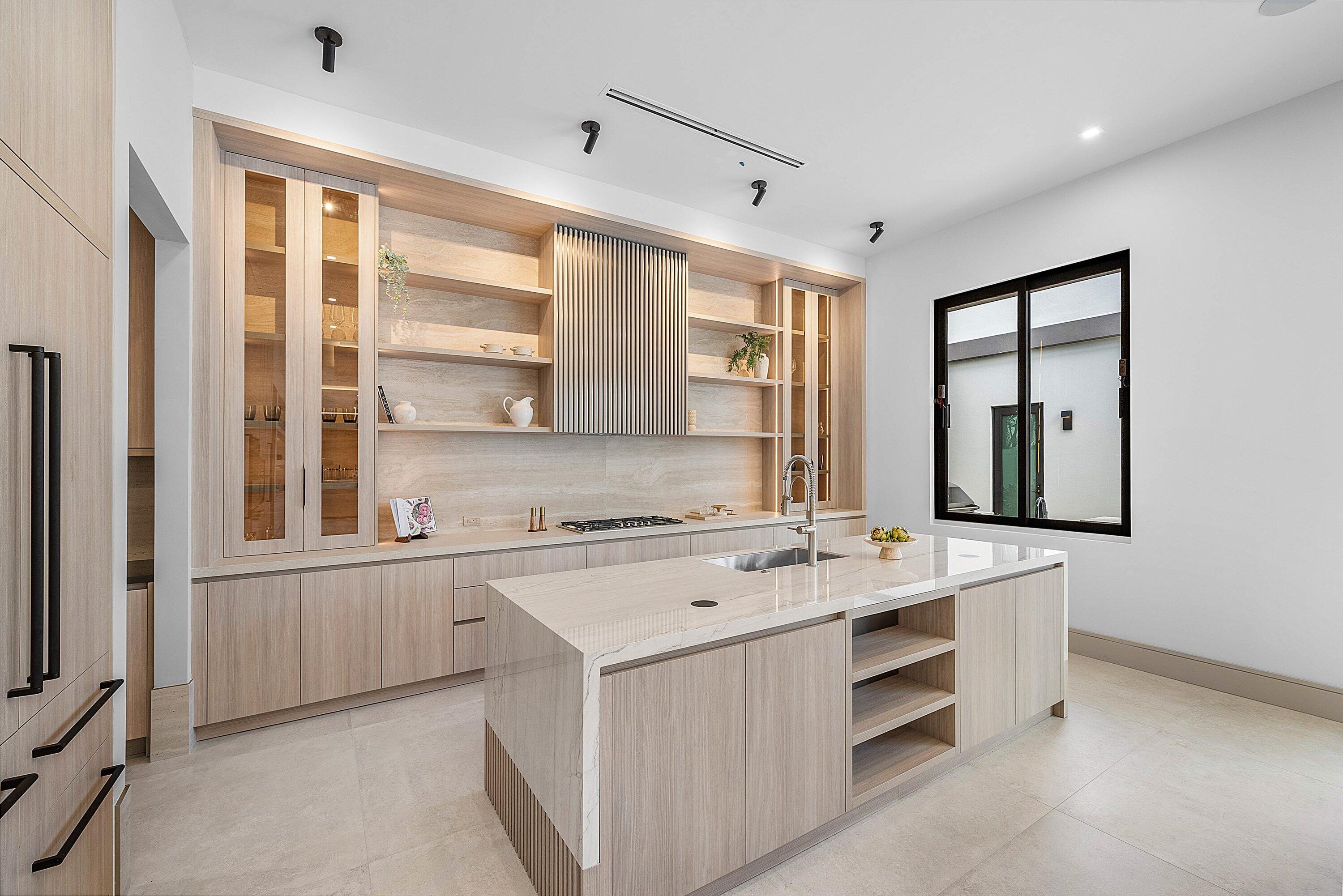 299 Northeast 7th Street Boca Raton, FL 33432 - Photo 11 of 112 a kitchen with a stove a sink and a window