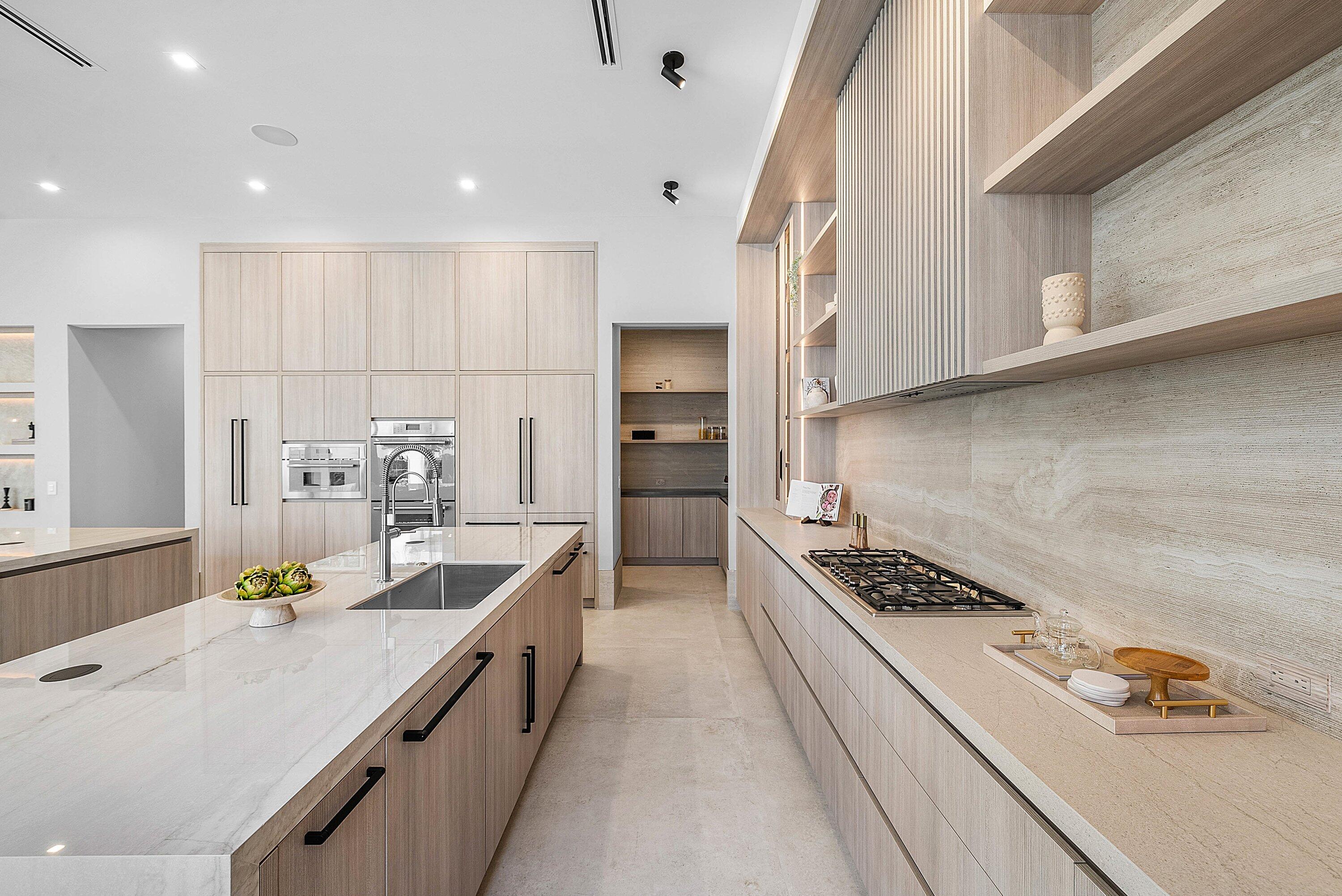 299 Northeast 7th Street Boca Raton, FL 33432 - Photo 12 of 112 a kitchen with white cabinets and appliances