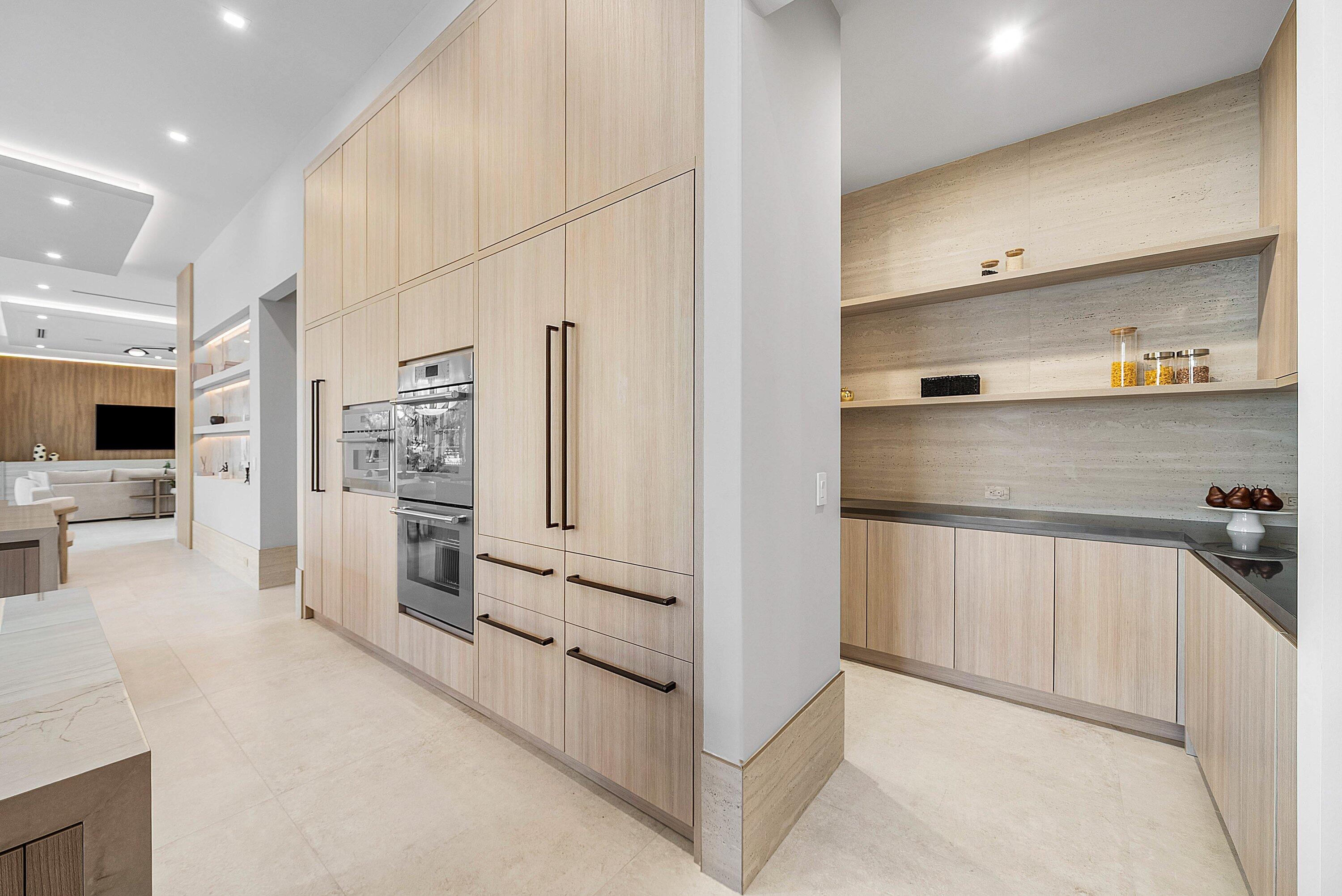 299 Northeast 7th Street Boca Raton, FL 33432 - Photo 21 of 112 a kitchen with stainless steel appliances a refrigerator and cabinets