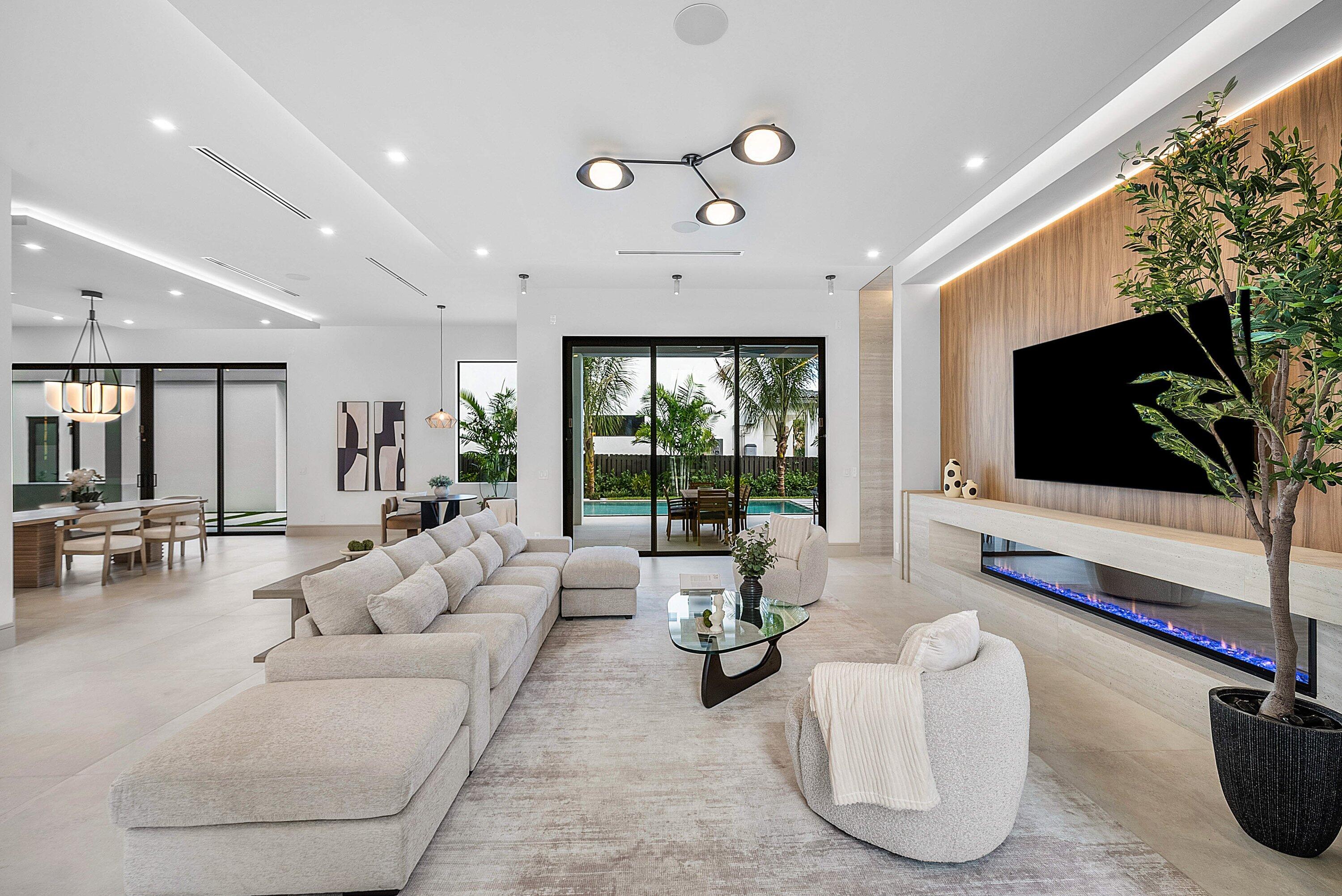 299 Northeast 7th Street Boca Raton, FL 33432 - Photo 27 of 112 a living room with furniture and a flat screen tv