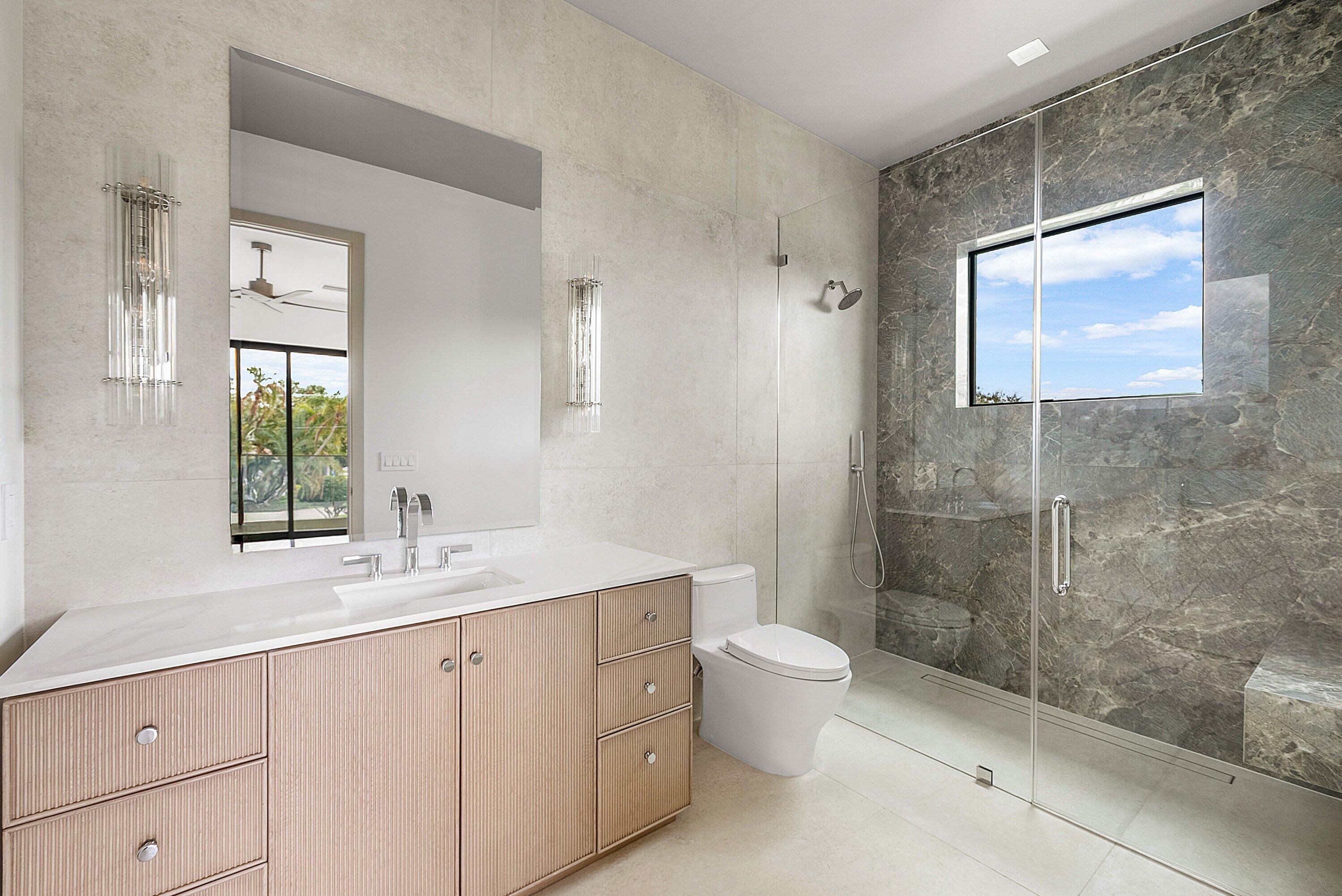 299 Northeast 7th Street Boca Raton, FL 33432 - Photo 36 of 112 a bath room with a toilet a sink and a mirror