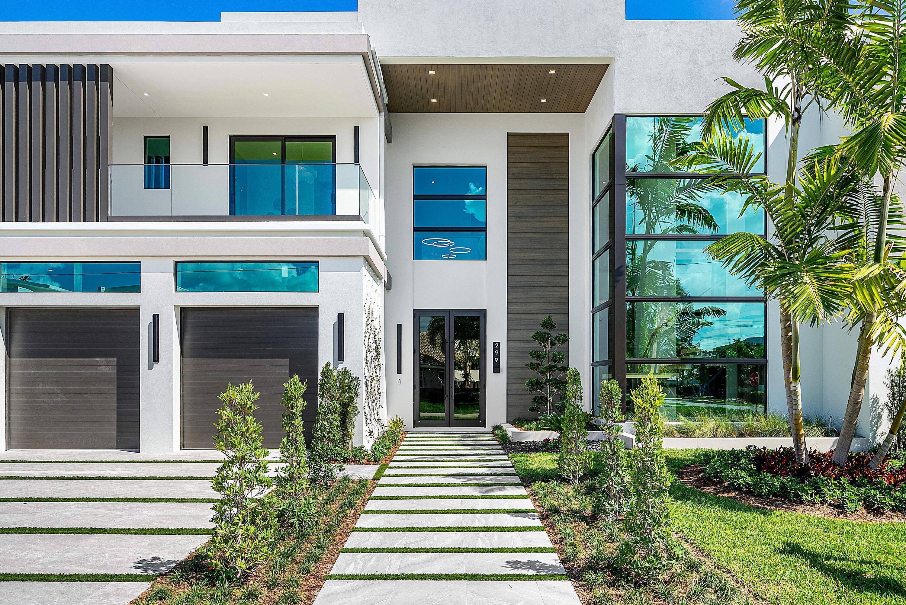 299 Northeast 7th Street Boca Raton, FL 33432 - Photo 4 of 112 a front view of a house with a porch