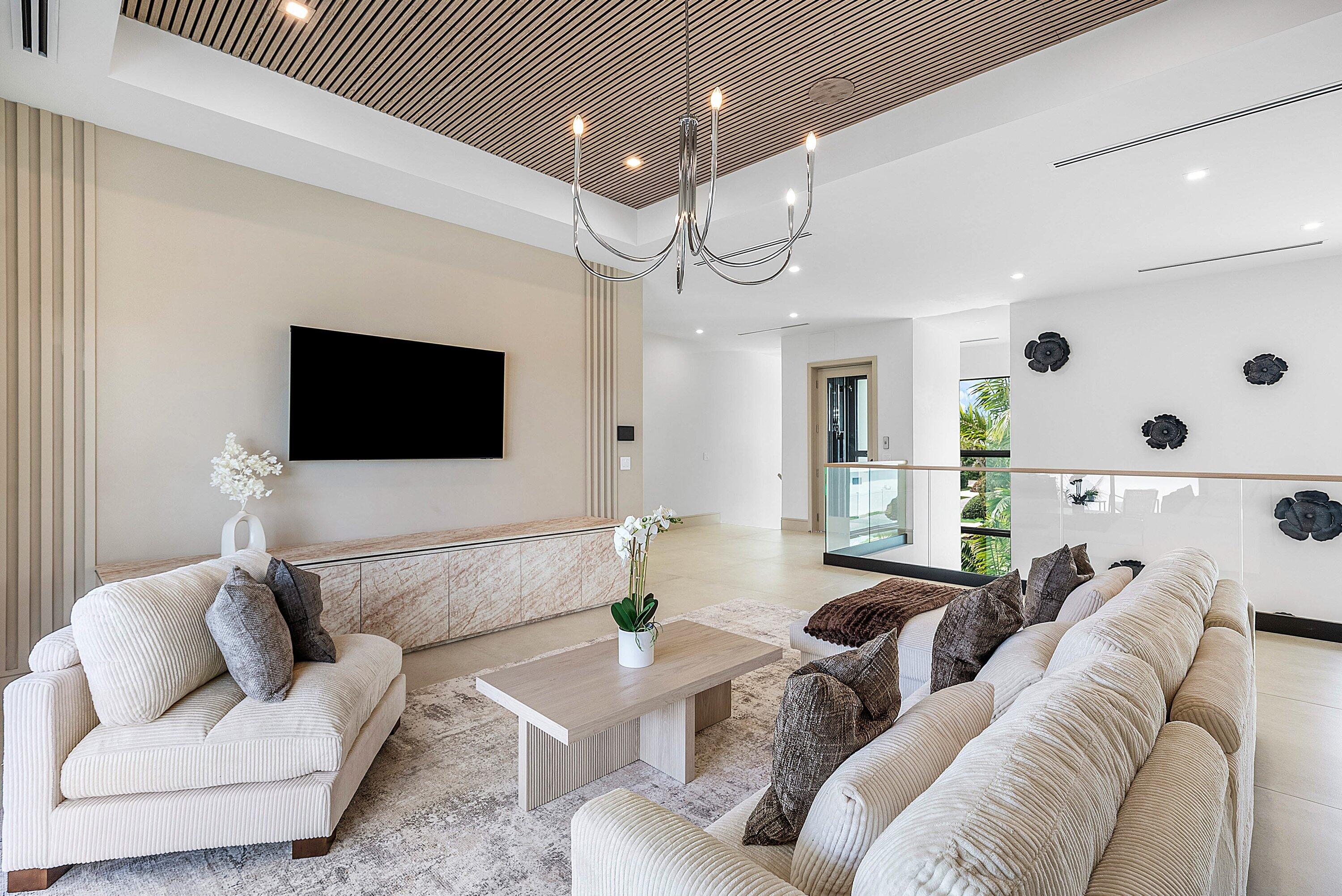 299 Northeast 7th Street Boca Raton, FL 33432 - Photo 42 of 112 a living room with furniture and a flat screen tv