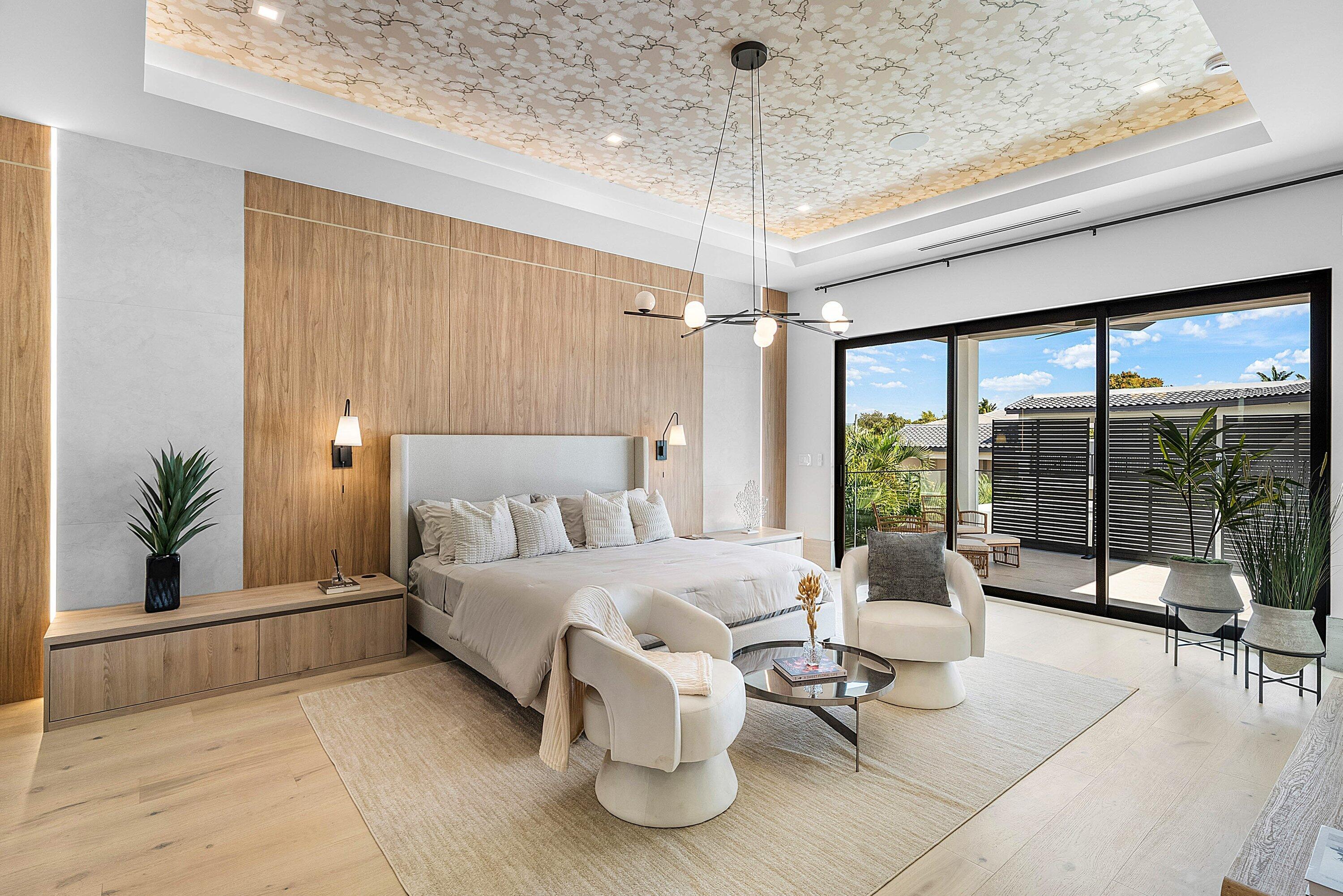 299 Northeast 7th Street Boca Raton, FL 33432 - Photo 50 of 112 a spacious bedroom with a bed and a chandelier