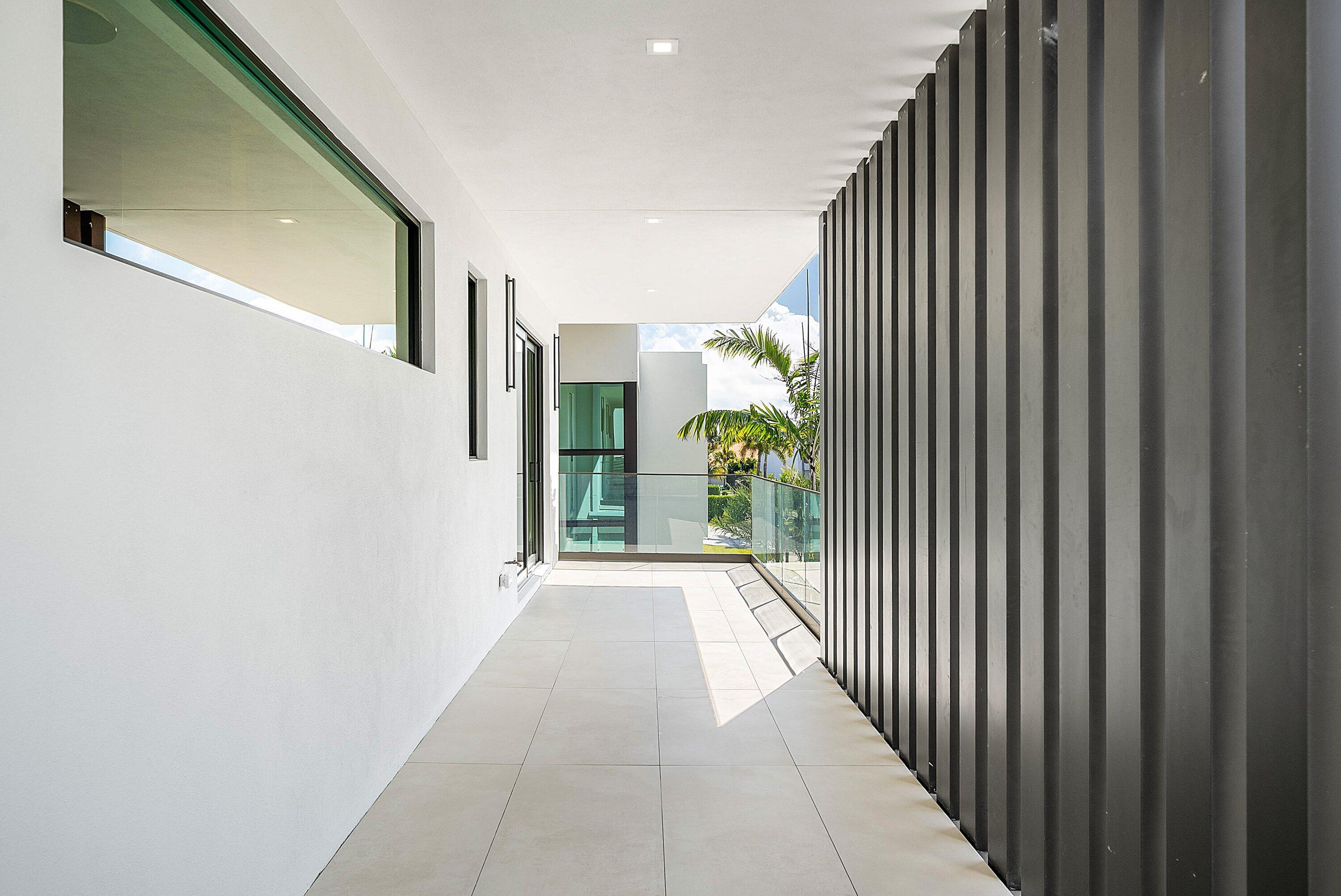 299 Northeast 7th Street Boca Raton, FL 33432 - Photo 64 of 112 a view of a back yard from a corridor