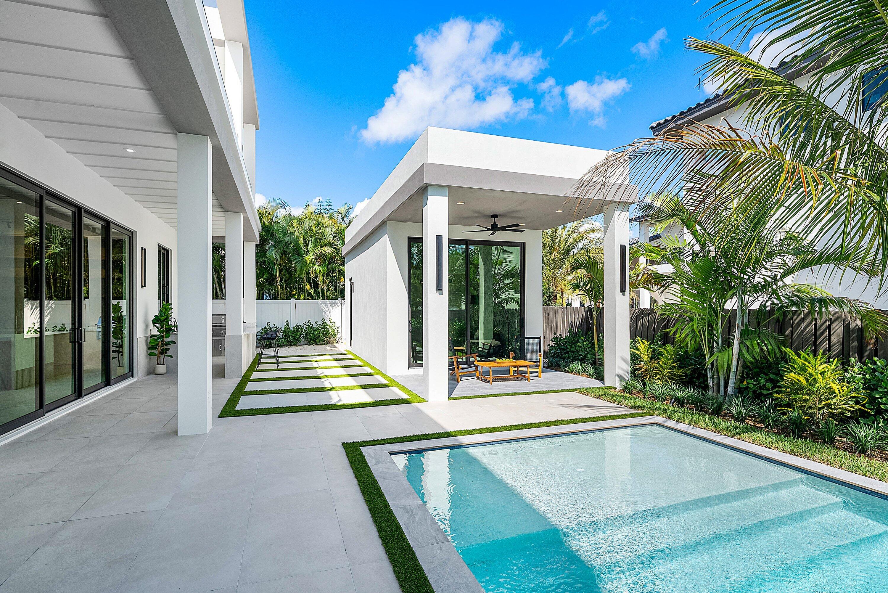 299 Northeast 7th Street Boca Raton, FL 33432 - Photo 77 of 112 a view of outdoor space yard deck patio and swimming pool