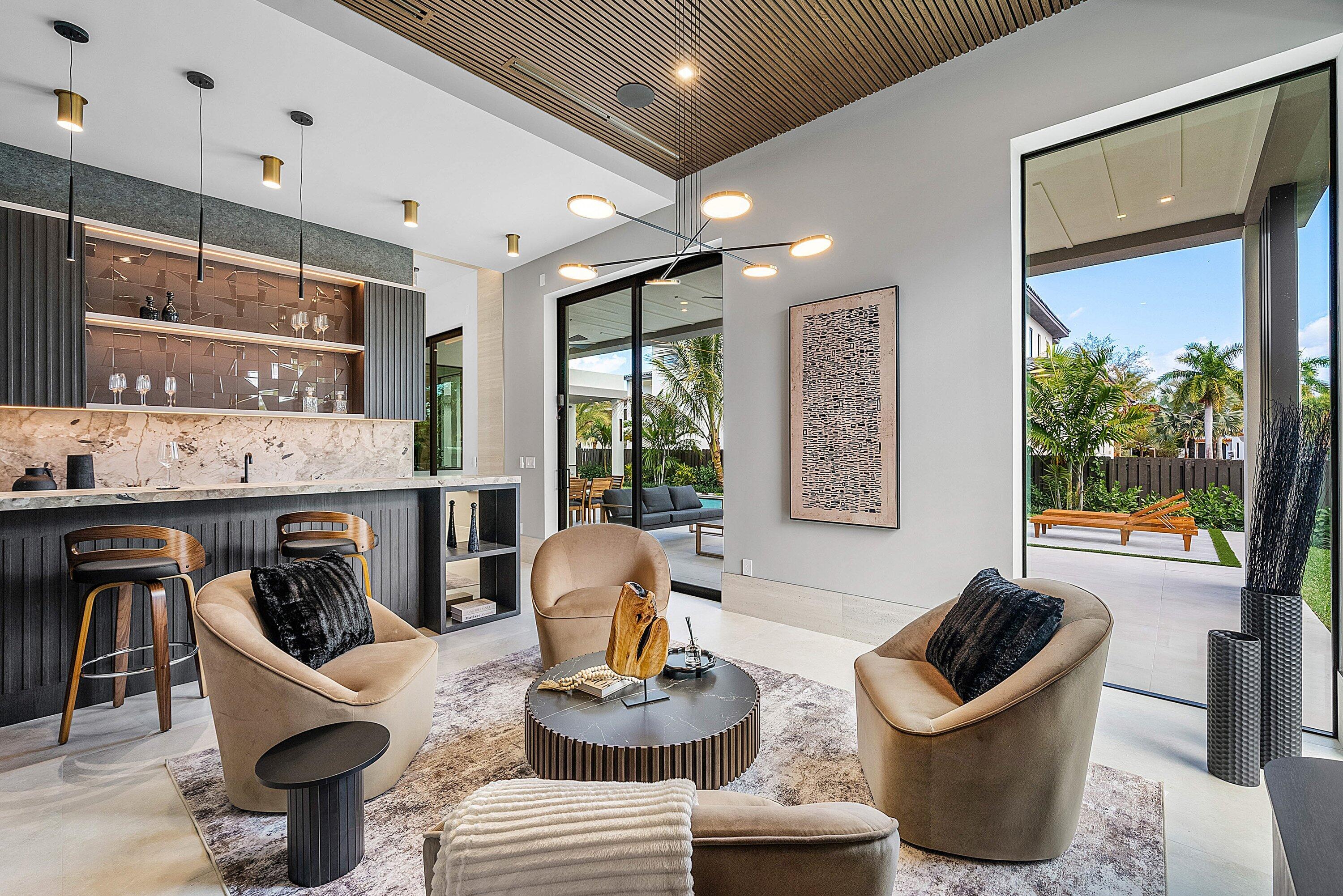 299 Northeast 7th Street Boca Raton, FL 33432 - Photo 8 of 112 a living room with furniture and a floor to ceiling window