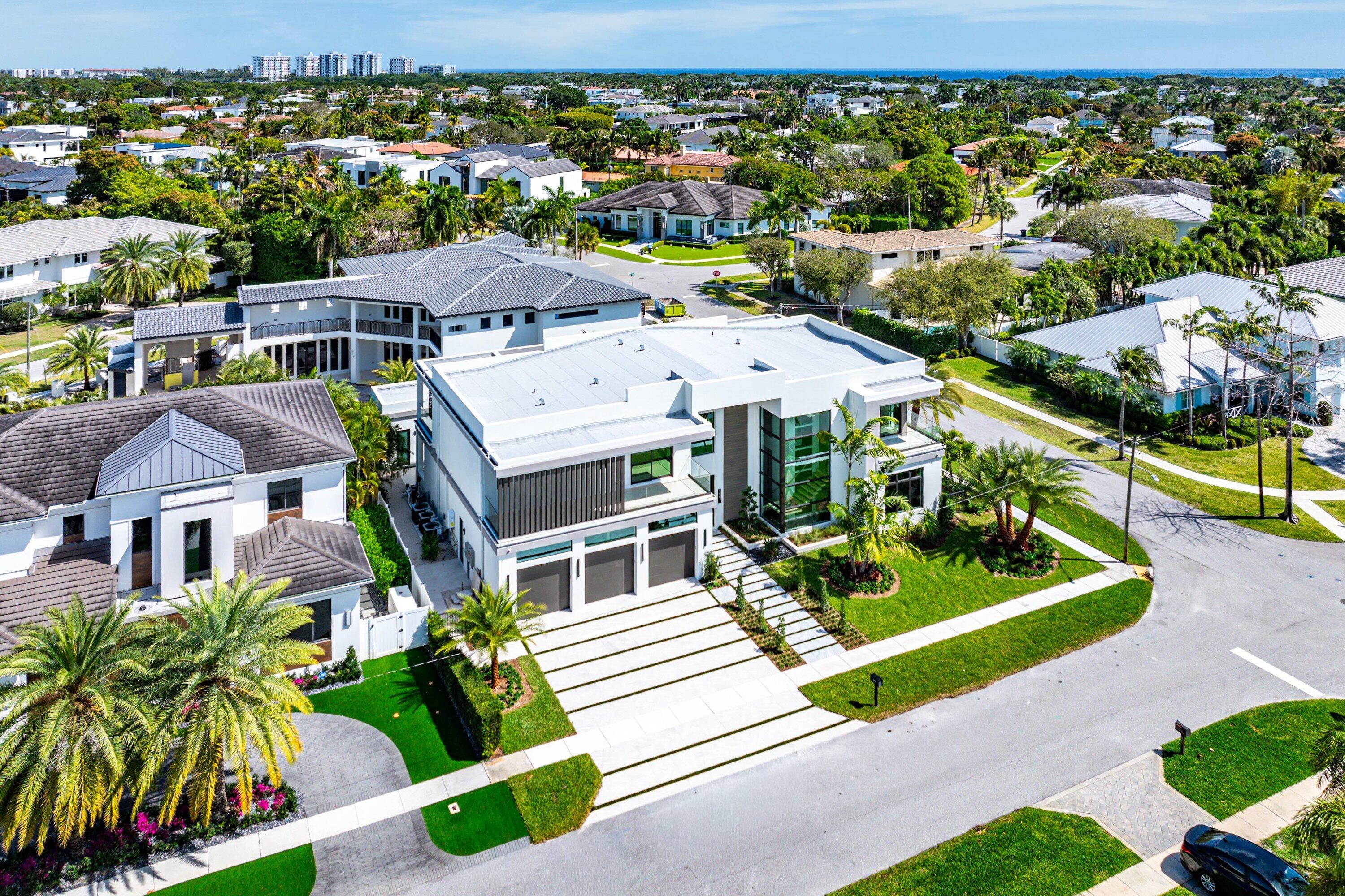 299 Northeast 7th Street Boca Raton, FL 33432 - Photo 82 of 112 an aerial view of multiple houses with a yard