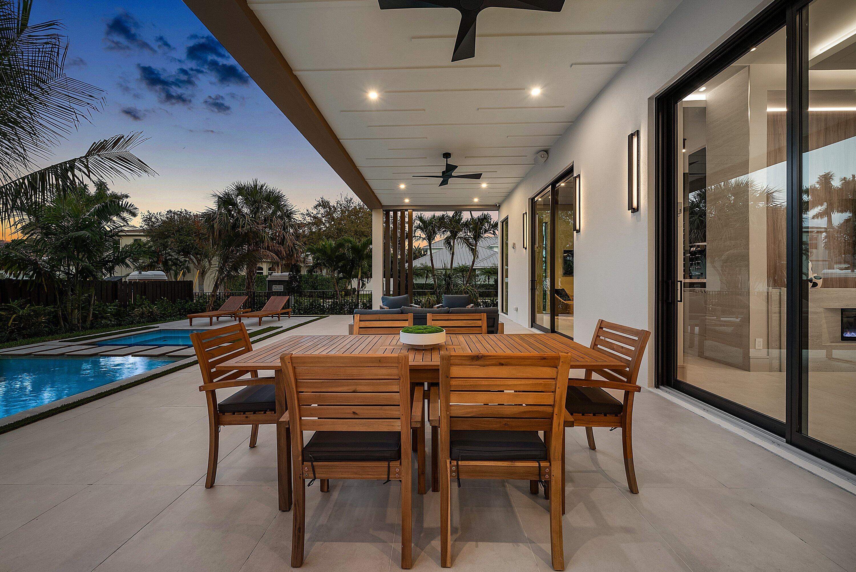 299 Northeast 7th Street Boca Raton, FL 33432 - Photo 99 of 112 a outdoor dining space with furniture and outdoor view