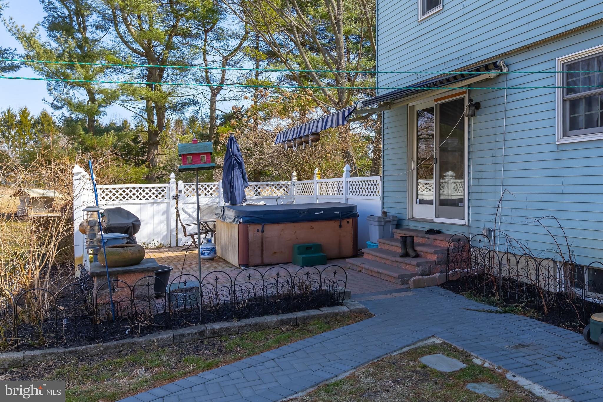 54 Vestry Road Swedesboro, NJ 08085 - Photo 34 of 59 Rear Paver patio with awning and hot tub